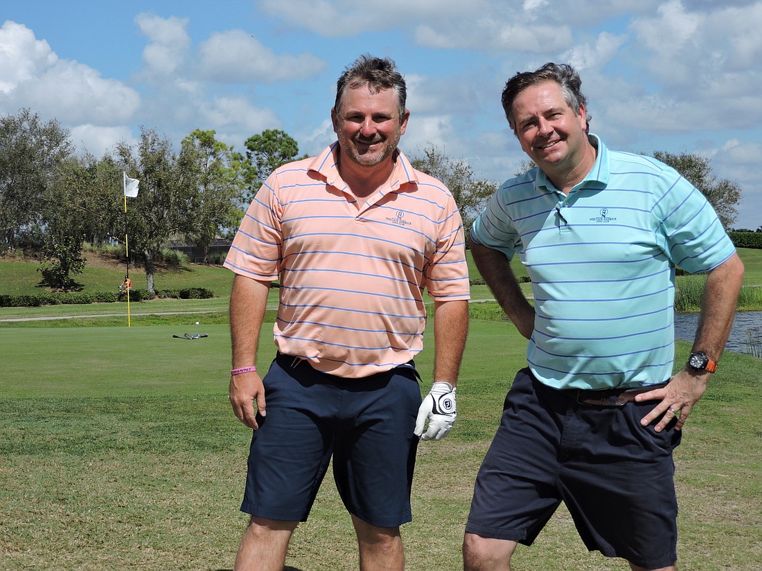 Heritage Harbour Golf & Eatery investor Bryan Veith enjoys a round with co-owner Chris Bradshaw.