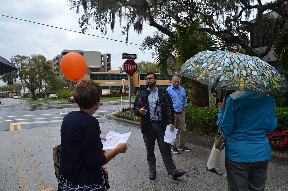Chris Cianfaglione leads a walking tour of the Selby Gardens campus Tuesday, outlining the location of a proposed parking garage on the bayfront property.