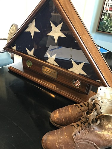 A courtesy photo from Miriam Zelin&#39;s memorial service shows her boots next to the American flag.
