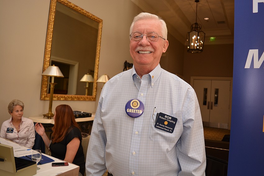 Rotary's Bob Grepling, whose daughter Stephanie Grepling also is a Rotary member, greets guests as they arrive.