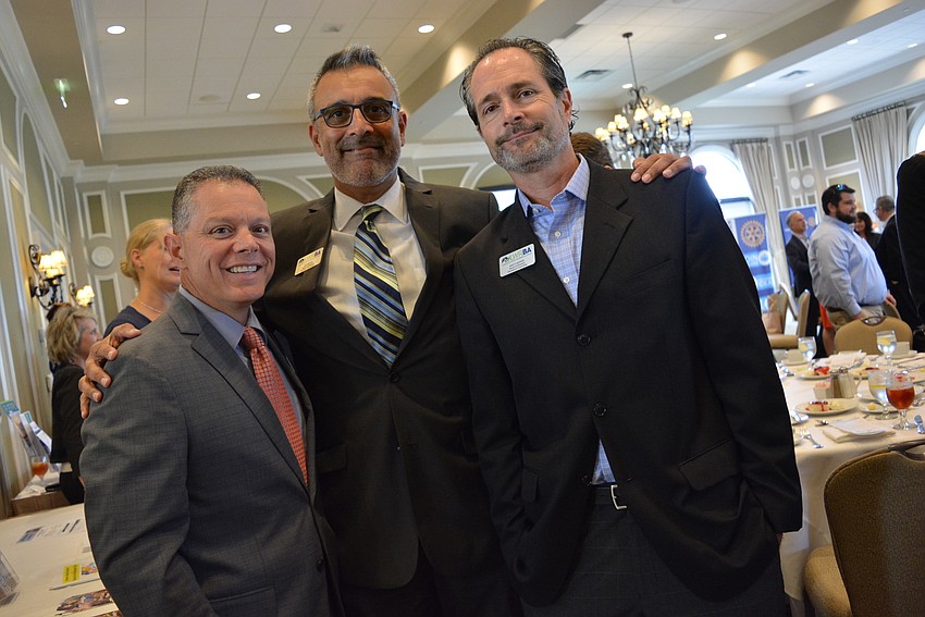 Lakewood Ranch Business Alliance board members Dom DiMaio, Jag Grewal and Brett Morris chat before guests sit for lunch and the keynote speaker.