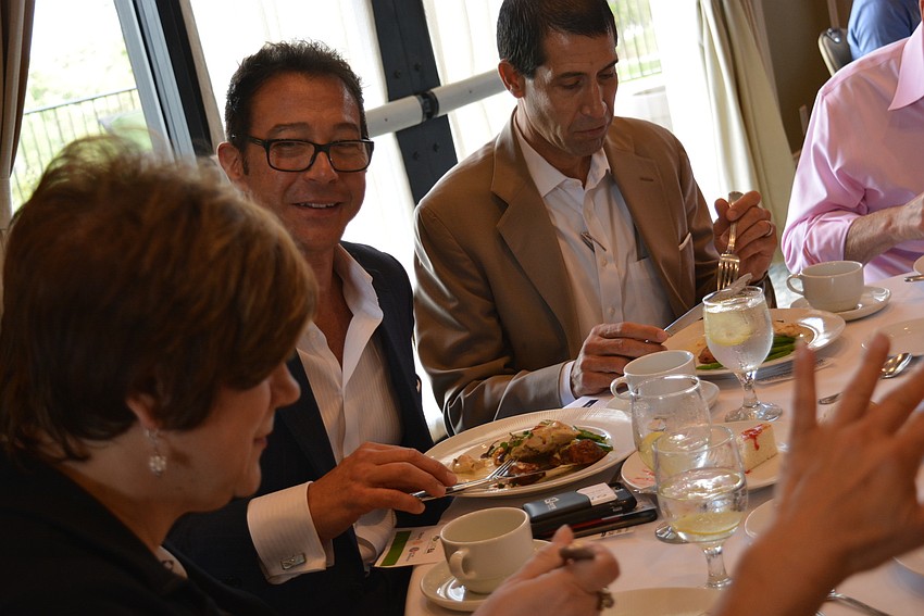 RTI Insurance's Johnny Hroncich, with the Lakewood Ranch Business Alliance, introduces himsef to other guests at the table.