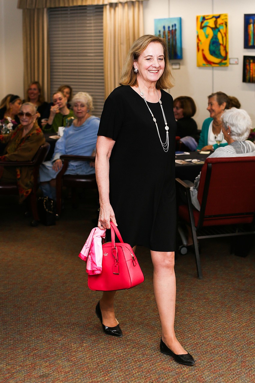 Ann Logan is carrying a new Kate Spade bag.