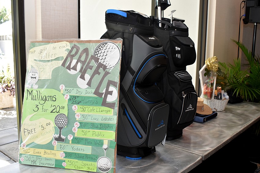 Raffle prizes included golf clubs and gift cards to local restaurants.