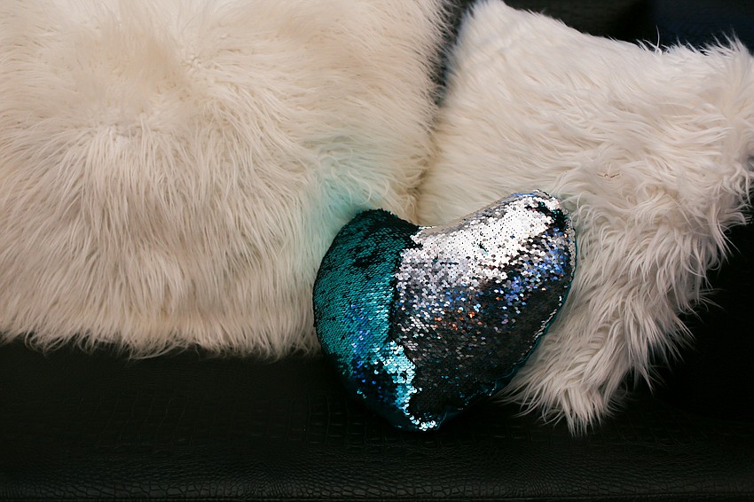 Teal furnishings decorated the lounge space.