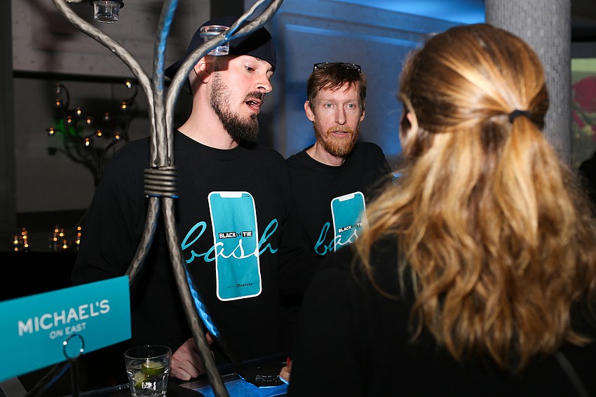 Caleb Stanton and Adam Quinlin show guests how to download and use the app.