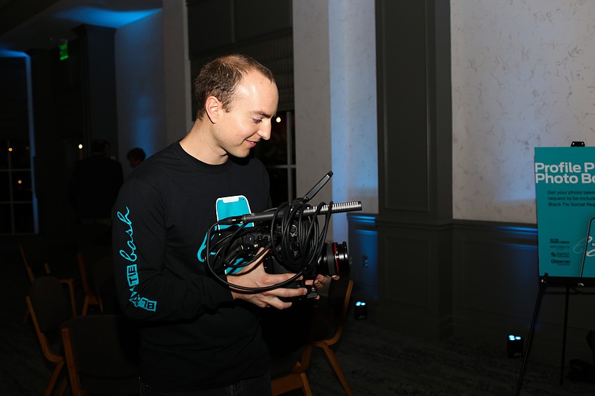 Colin Reid takes video of the event.