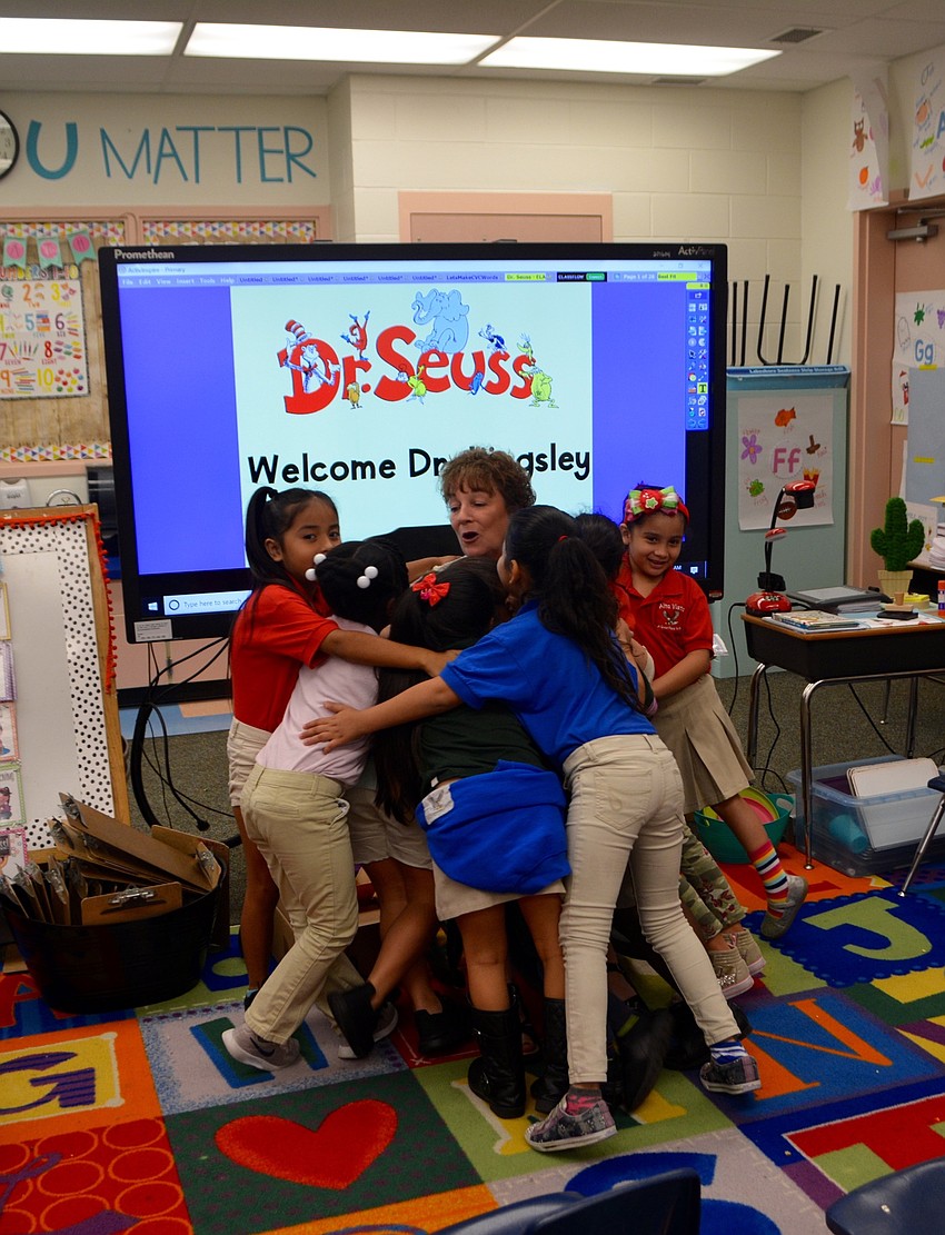 After the reading was over, students rushed in to hug Kingsley.