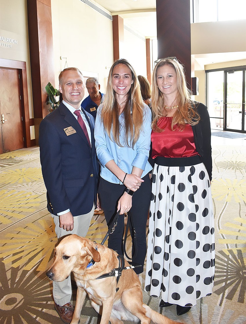 AJ Gonzales, Marisa Gerlach and Jennifer Groff with Astro the guide dog