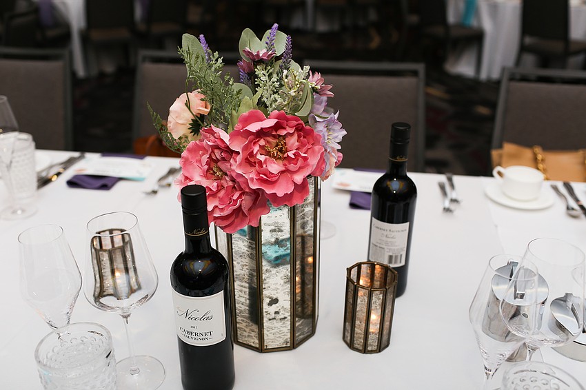 The tables were decorated with flowers and vintage-style vases.