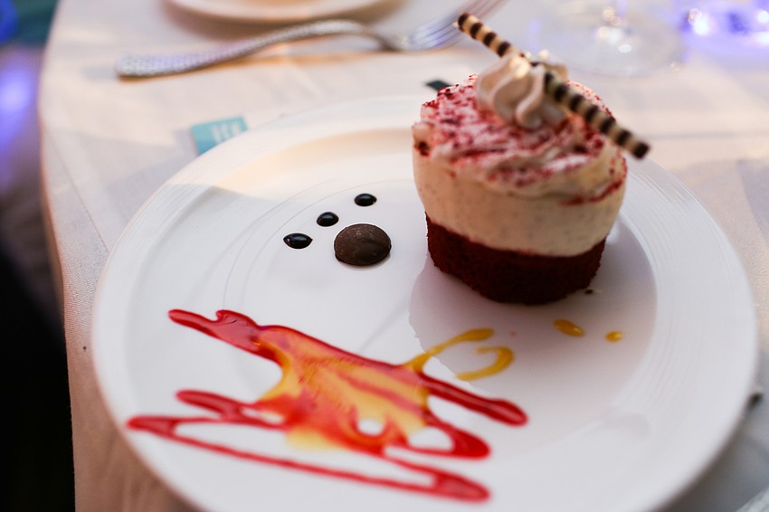 The dessert was a red velvet cupcake with a chocolate paw print.