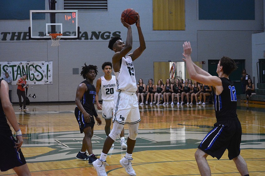 Lakewood Ranch High senior forward Josh Young hits a midrange jumper against East Lake High.