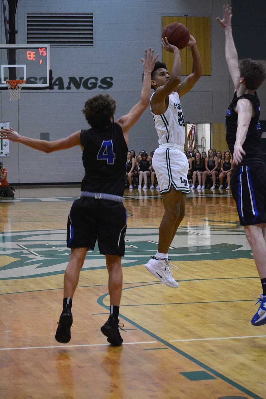 Mustangs junior Keon Buckley takes an outside shot.