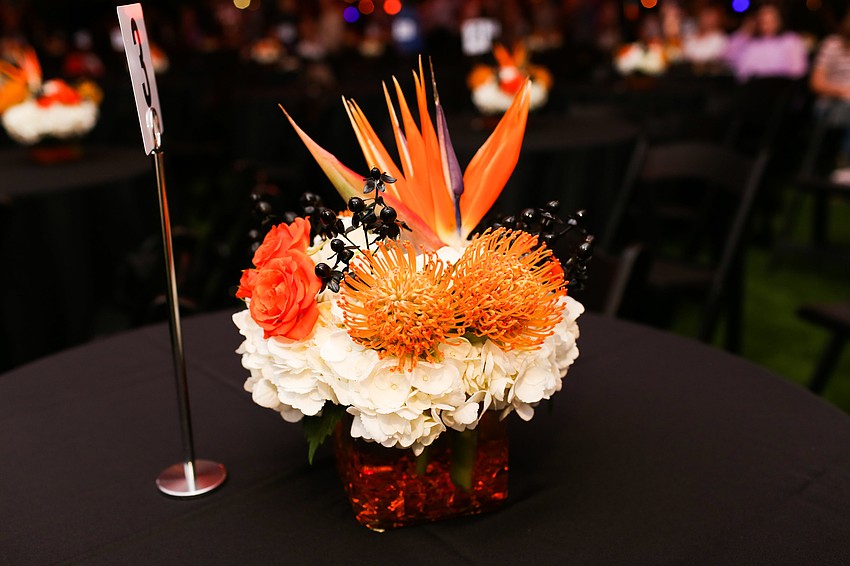 Bright orange florals decorated the tables.