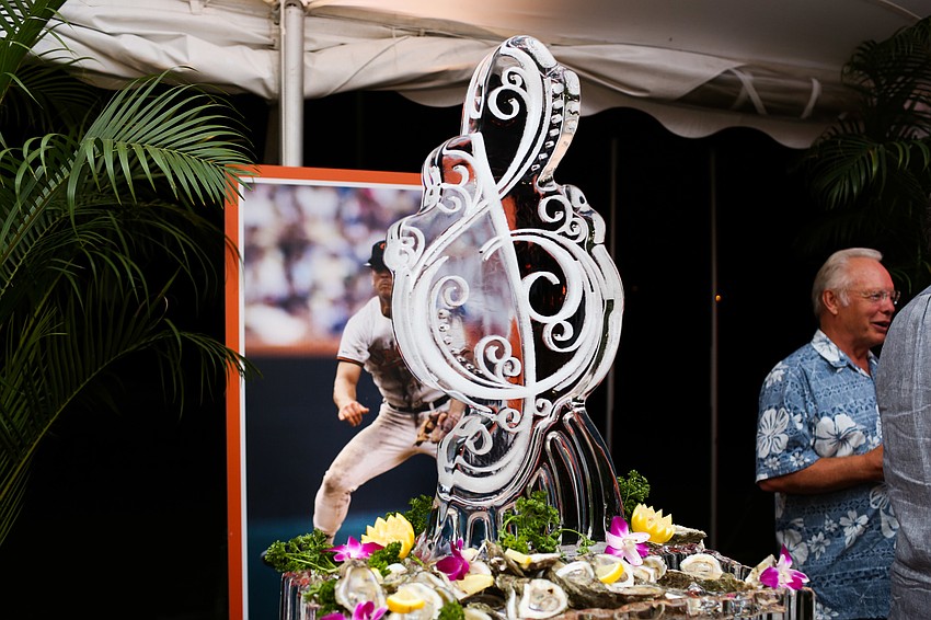 An ice sculpture shaped like a music note helped keep the seafood cold.