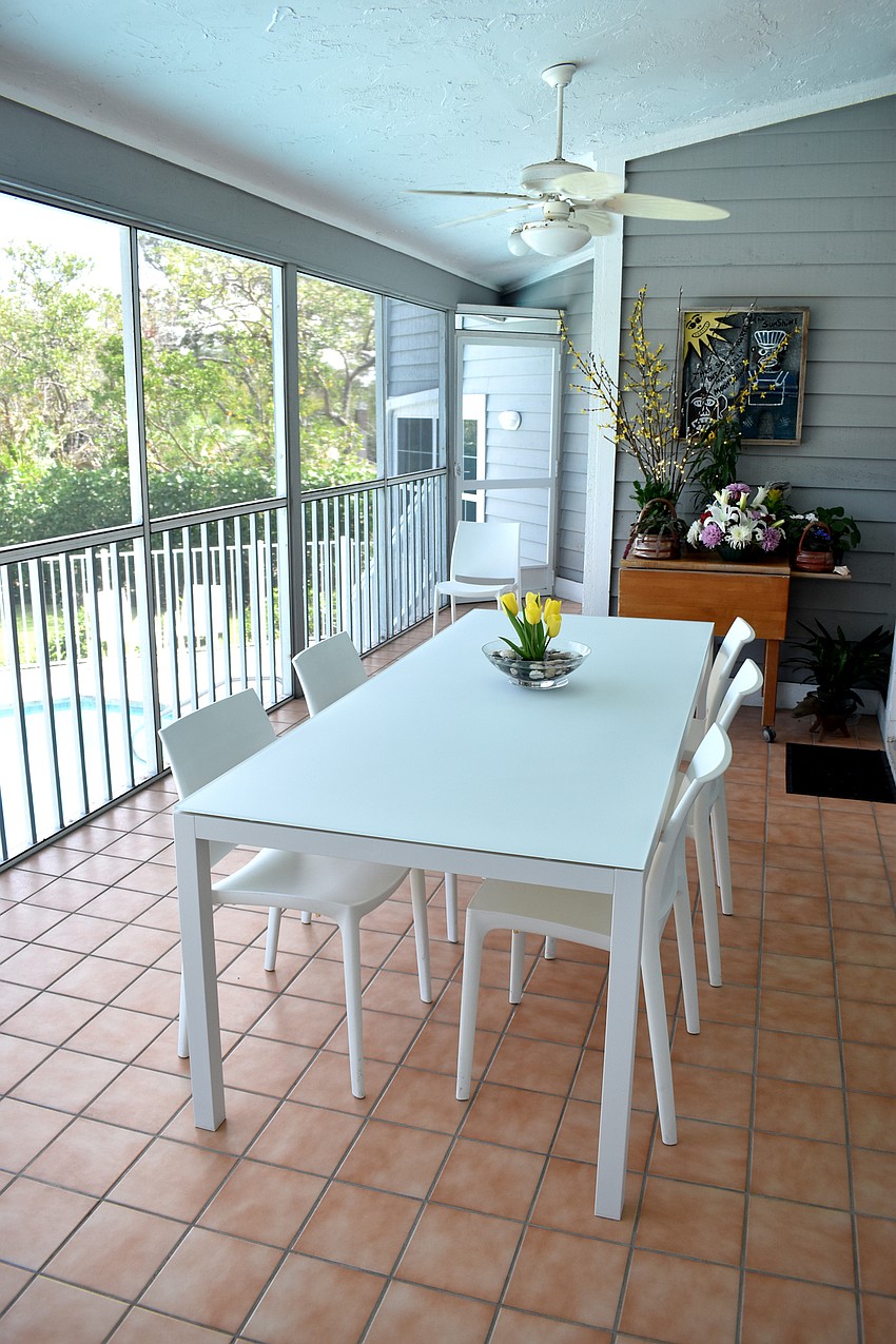 The Maass home has a screened deck off the kitchen offering a view of the pool.