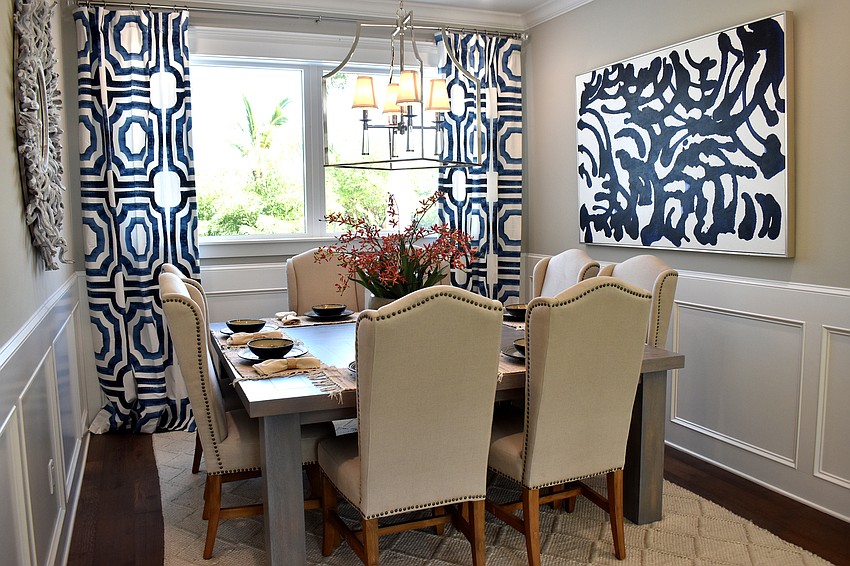 A new home features cream and blue coloring in a dining area.