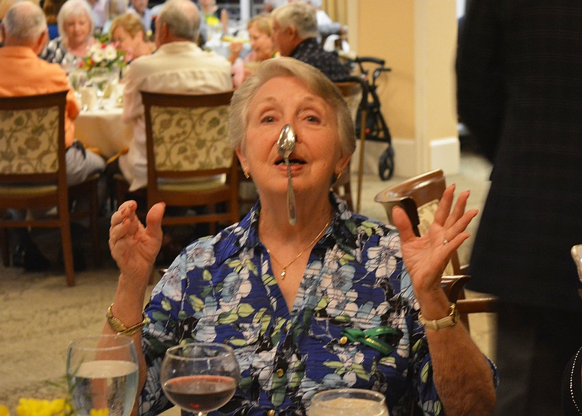 Ada Newton, a resident since 2001, balances a spoon on her nose for fun. 