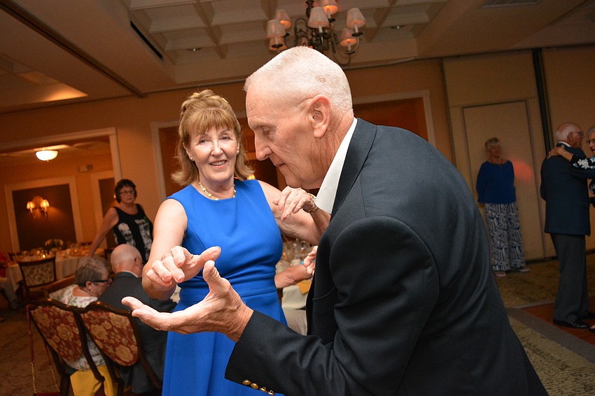 Jean Furner dances with 14-year Tara Golf and Country Club resident Iain Webster after dinner.