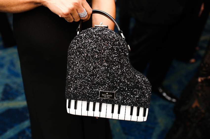 Shari Phillips carried a Kate Spade piano purse.