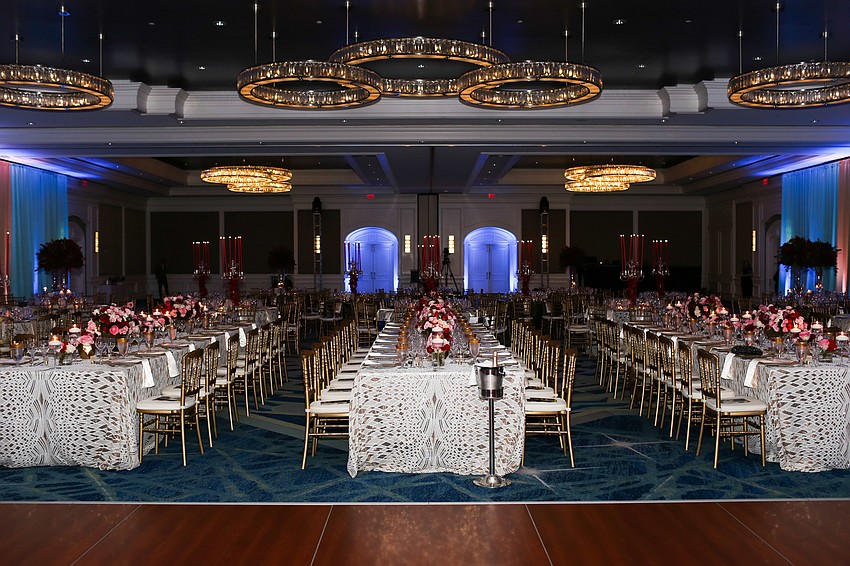 Three long tables centered the ballroom.