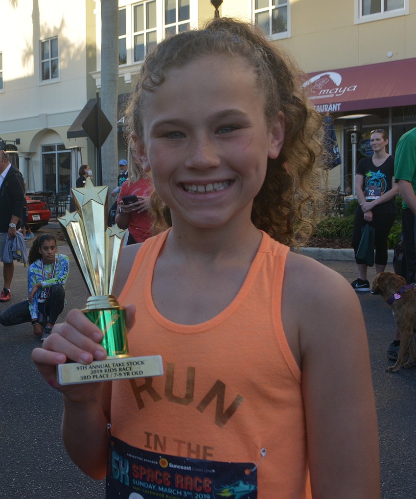 Sabel Harbour 9-year-old Alexis Hutter shows off her third-place trophy.