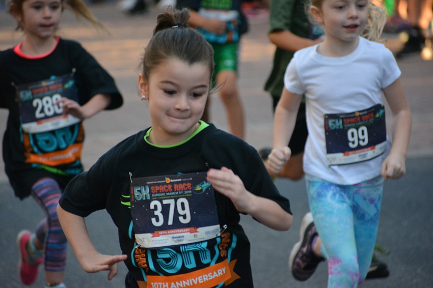 Parrish's Mikayla Smith bursts to the lead of the 5-6 age group race.