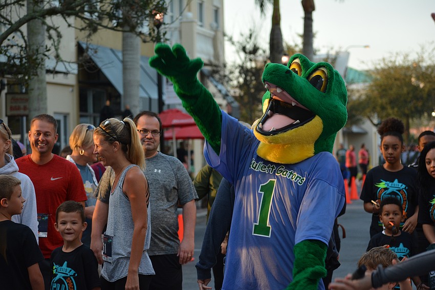 Chompy, the Gullett Elementary Gators' mascot, does the chomp.