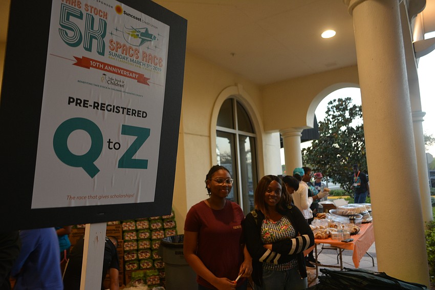 Volunteers Shaiyan Pierre and her mom, Kedna Pierre, manned the Q-Z station.