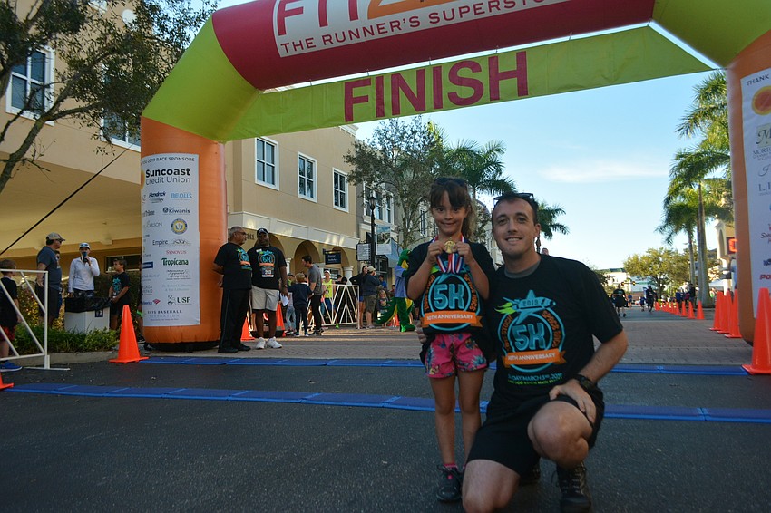 Gullett first-grader Era Gibbons and her dad, Andrew, both competed in the race.