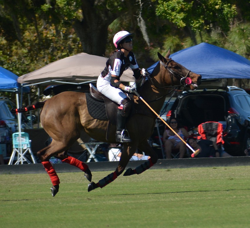 WIPN's Alyson Poor rips a shot in the final chukker.