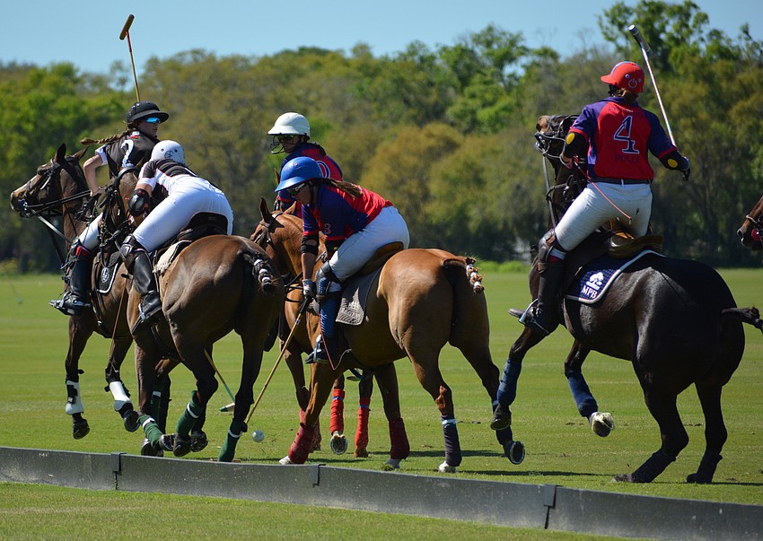Ten Oaks' Tiva Gross tries to dig the ball out away from the boards.