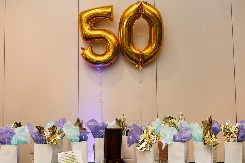 Guests could purchase a surprise bottle of wine with a minimum value of $20.