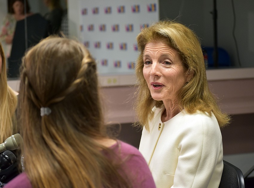Caroline Kennedy fields questions from journalists before giving her speech.