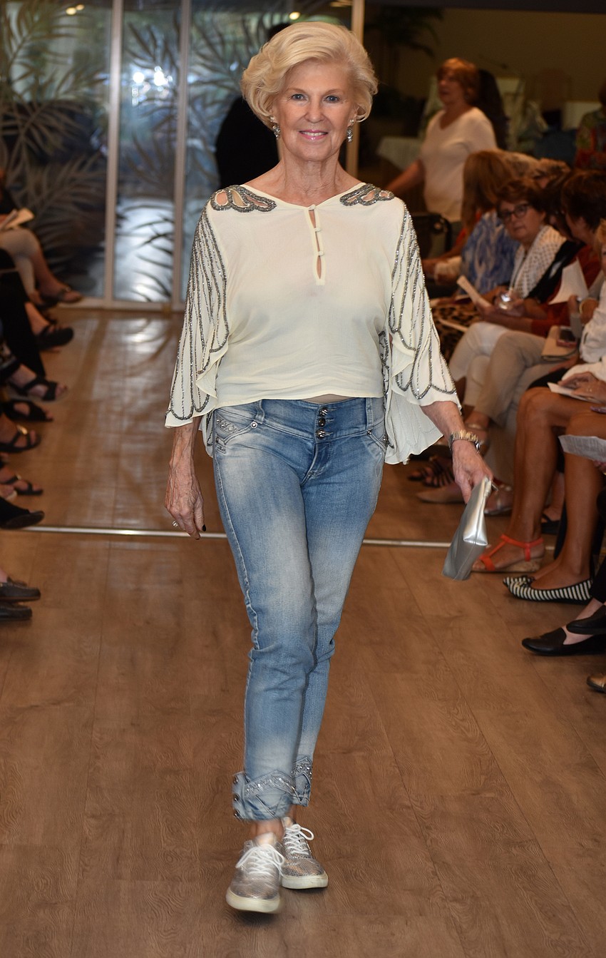 Carol O’Brien models jeans and a sparkly top from the Lord’s Warehouse.