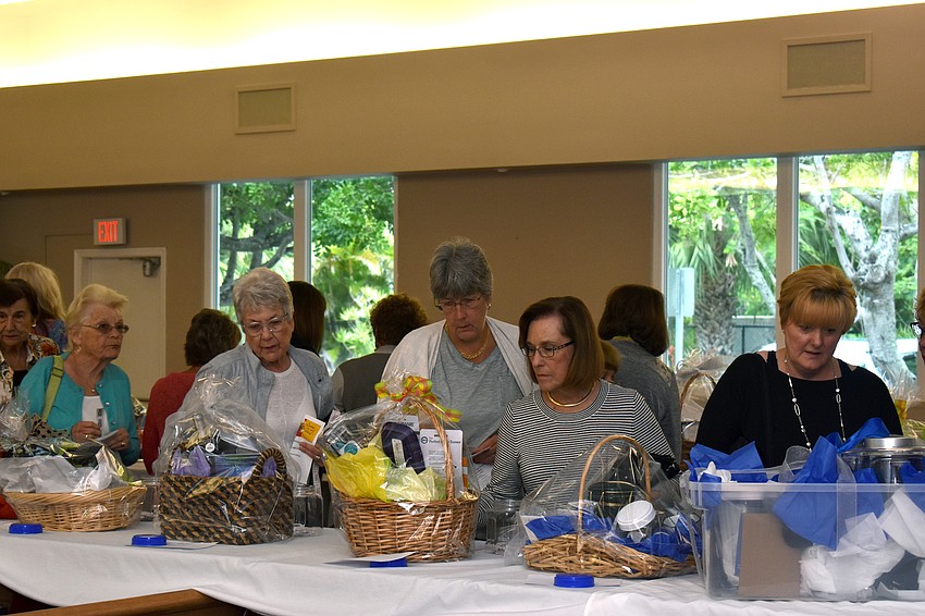 As guests arrived, they perused raffle and silent auction baskets.