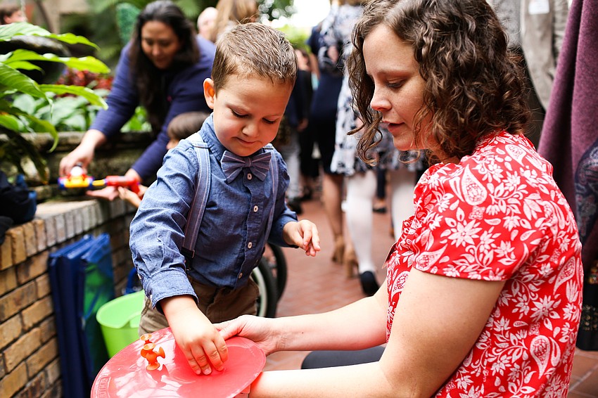 Axton, age 4, plays with Physical Therapist Hannah Warne