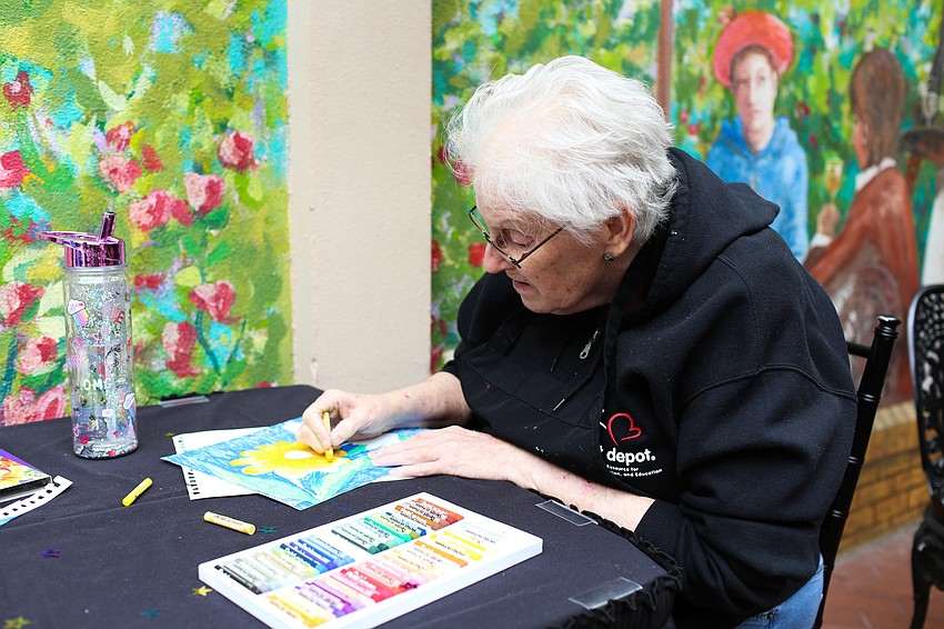 Cathy Havens colors a picture.