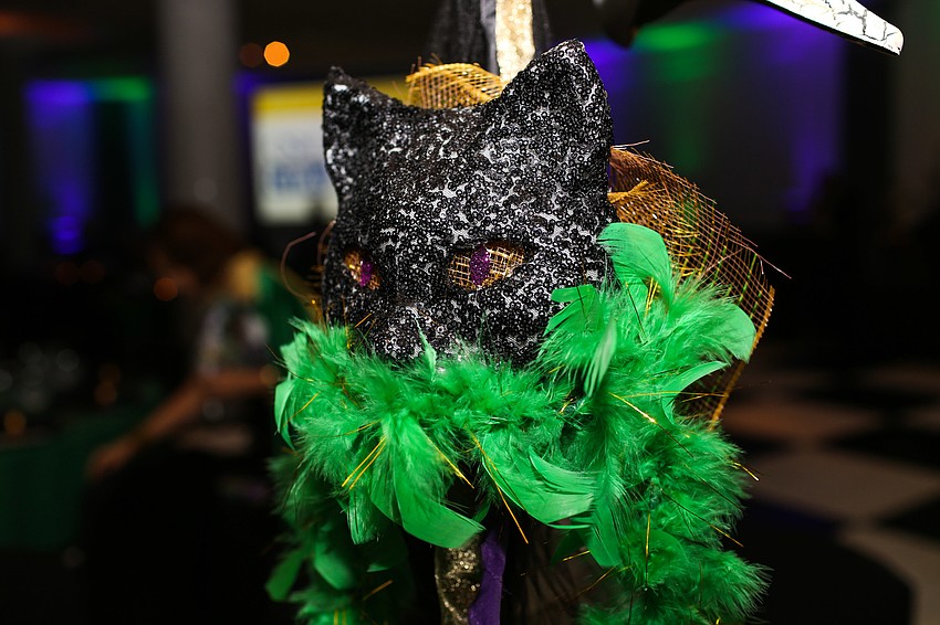 A cat mask decorates a table.