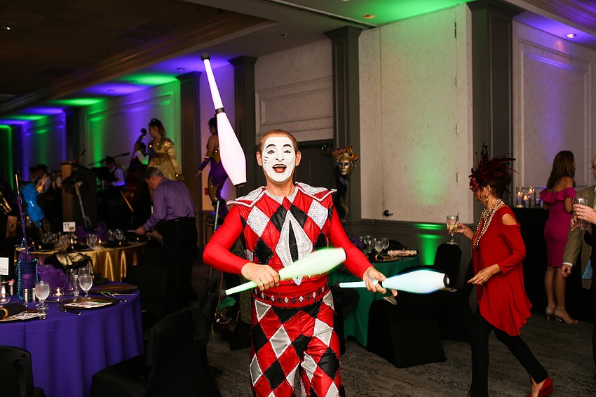 A Harlequin juggled around Michael's On East.