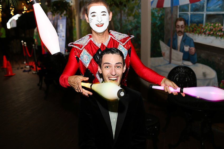 The Harlequin juggles around Brian Craft's head.