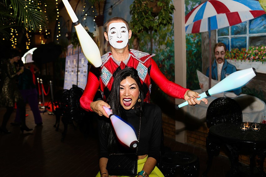 The Harlequin juggles around Patra Jordan's head.