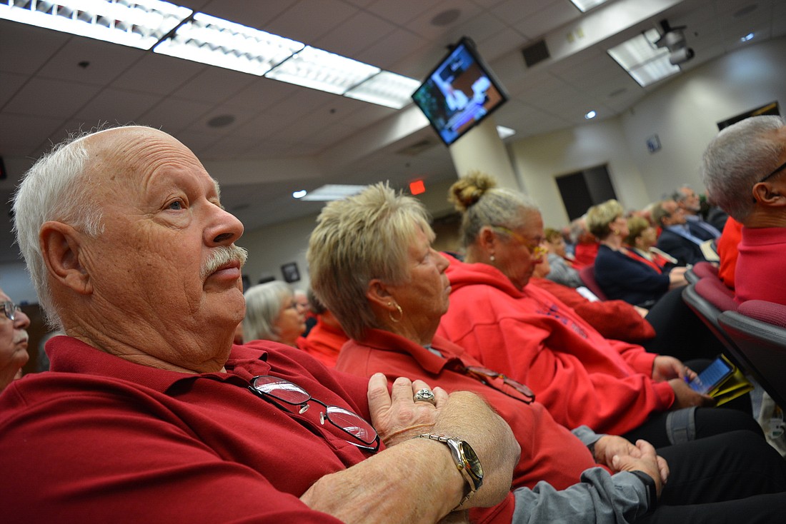 Residents of the overall Tara community, including The Preserve at Tara&#39;s David Woodhouse, sported red shirts to show their opposition to the settlement during the March 7 hearing.