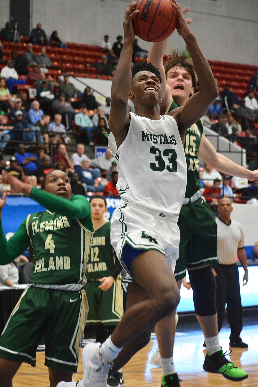 Josh Young drives for a layup against Fleming Island High.
