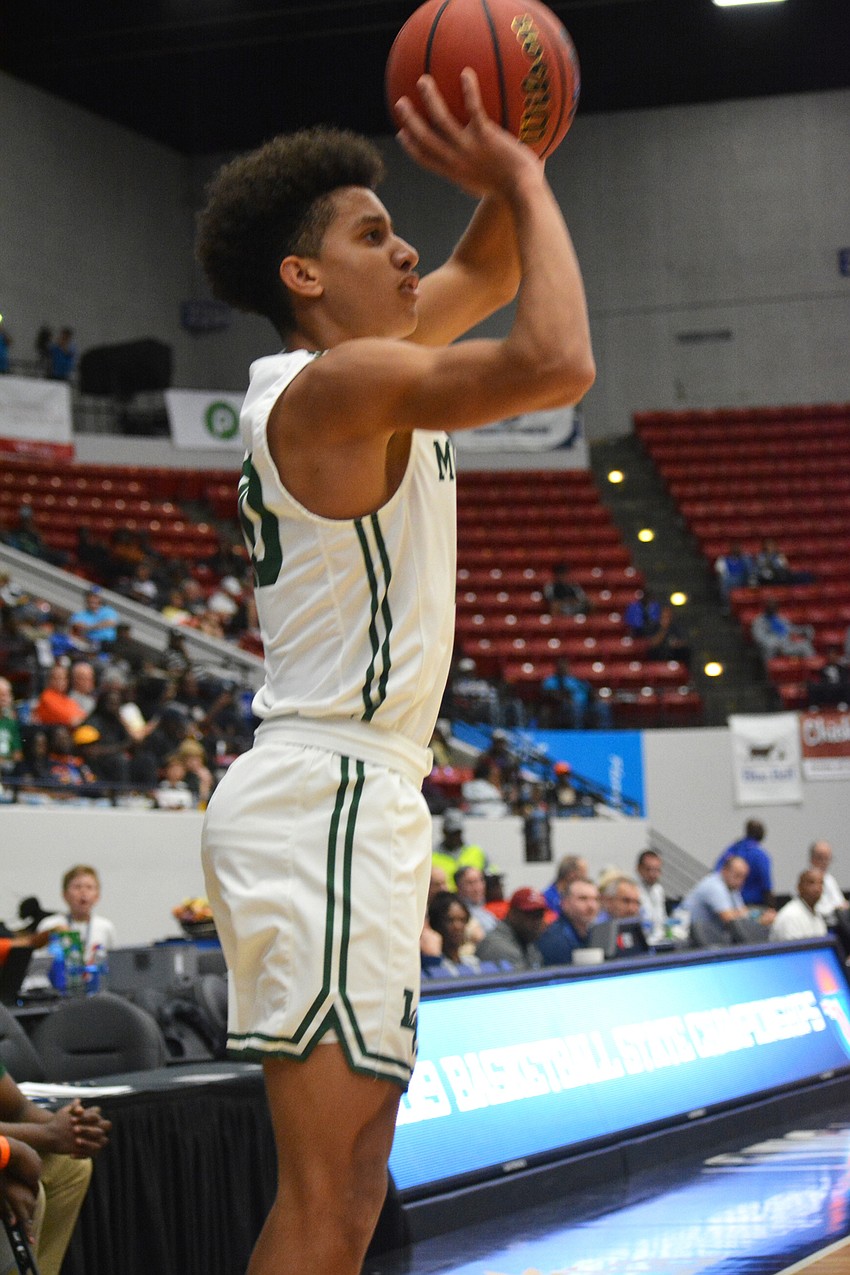 Keon Buckley hits a 3-point shot against Fleming Island. He finished with nine points.