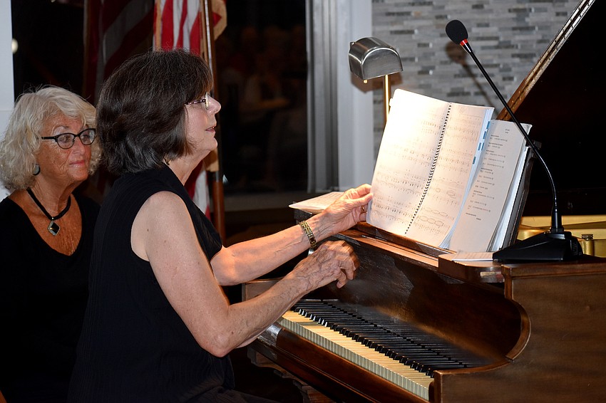 Jan Ortmann accompanies Bob Geraci on the piano.