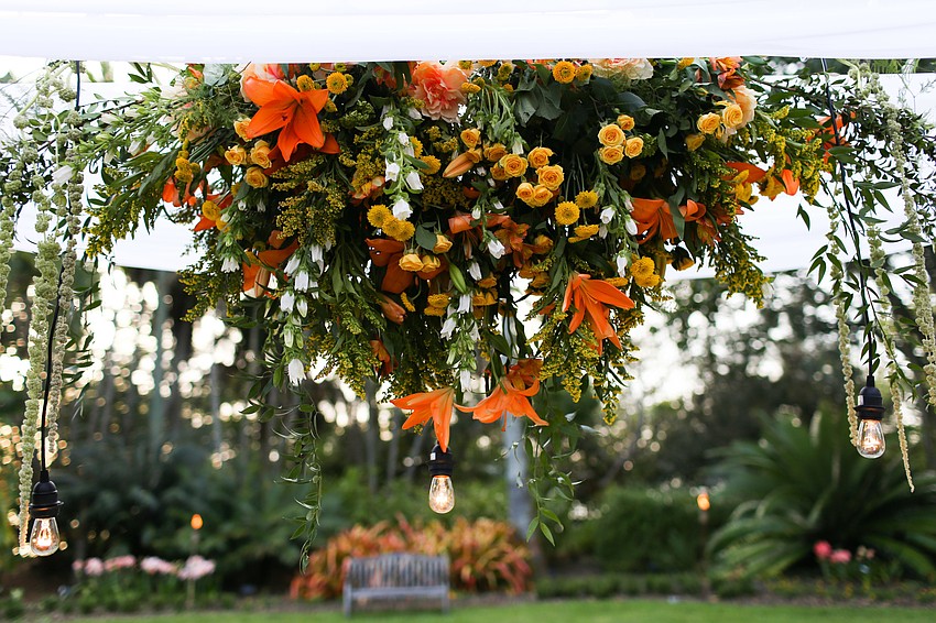 Floral arrangements hung above the table.