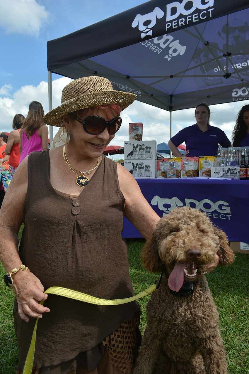 Waterlefe's Susan Woods walks at the polo grounds with Luna, her standard poodle.