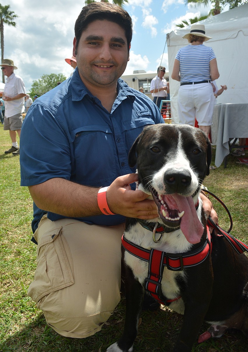 Alberto Rojas adopted Kemper, a 2-year-old pit bull and great dane mix, from Nate's three weeks ago.
