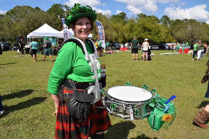 Cheri McDonough, of Lion Rampant Pipe & Drum, heads to her group's performance.